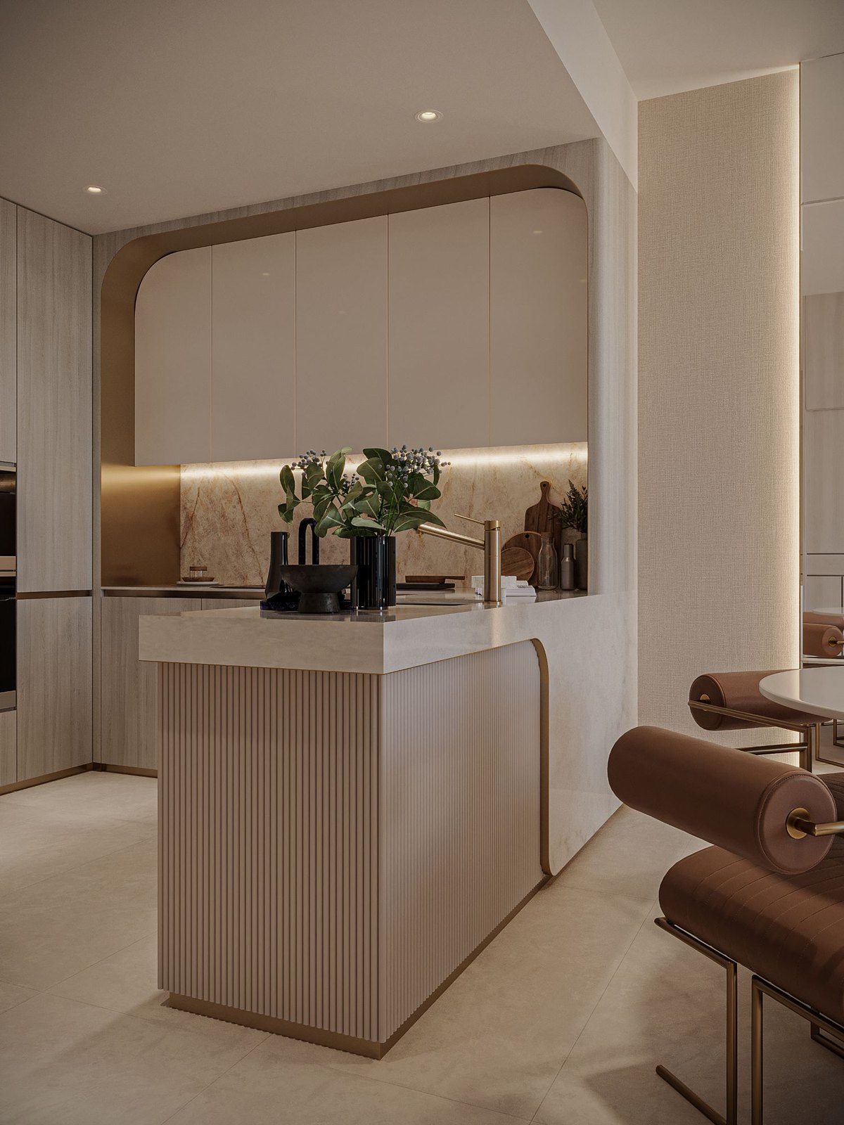 Floareá Skies: the kitchen island, fluted panels under a marble top, the bronze-edged splashback behind